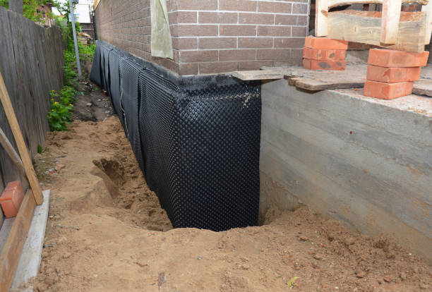 SJ Waterproofing Pros technician performing targeted Wet Basement Repair assessment in Mount Saint Joseph, OH